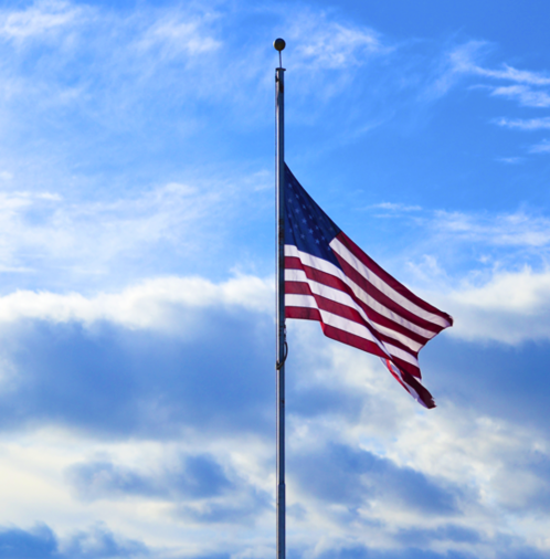 american flag at half staff featured.fw 1